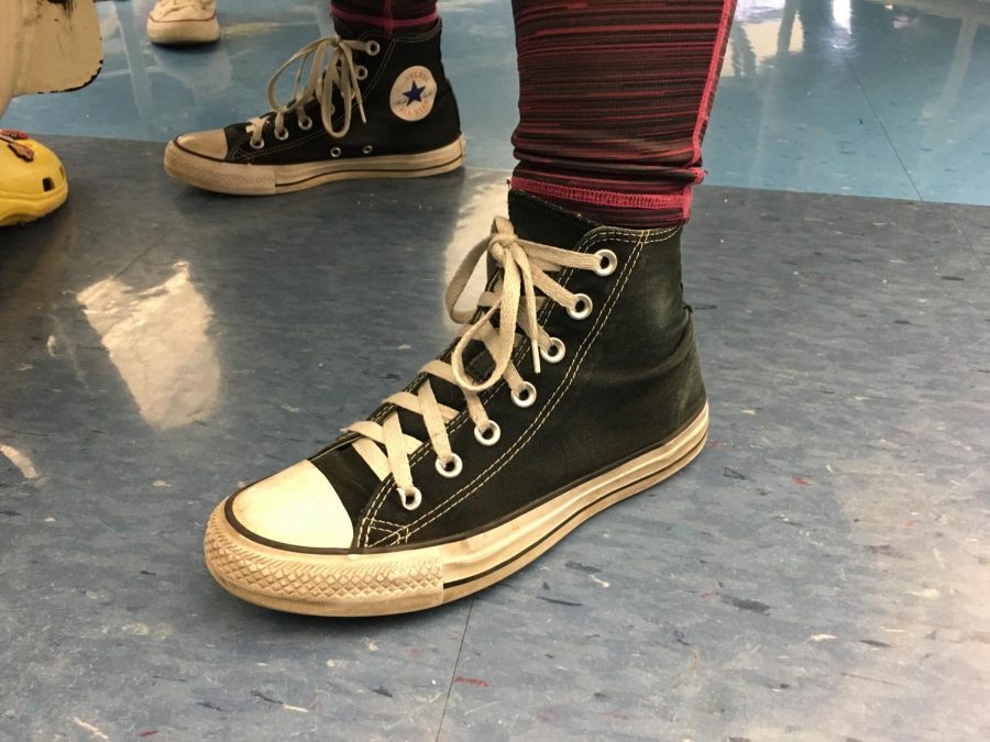 From bright yellow or pink or even personally customized, high tops were vital to any typical outfit in the 90s. Everyone loved them! That same love is returning with companies like Nike and Vans making colorful high tops along with the original brand, Converse. (Pictured: Kristen Hall)