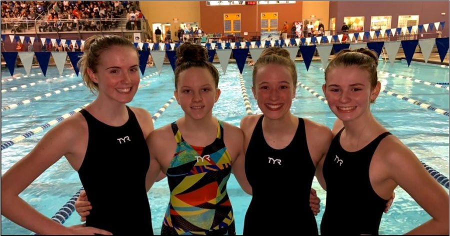 Boone’s girls 400-yard freestyle relay—(PICTURED AT REGIONAL FINALS FROM LEFT TO RIGHT) sophomore Caitlin Bailey, freshman Sydney Whitford, junior Becca Mulroney and freshman Sophie Pile—dropped 15.3 seconds at regionals to  beat Cooper by a half second.