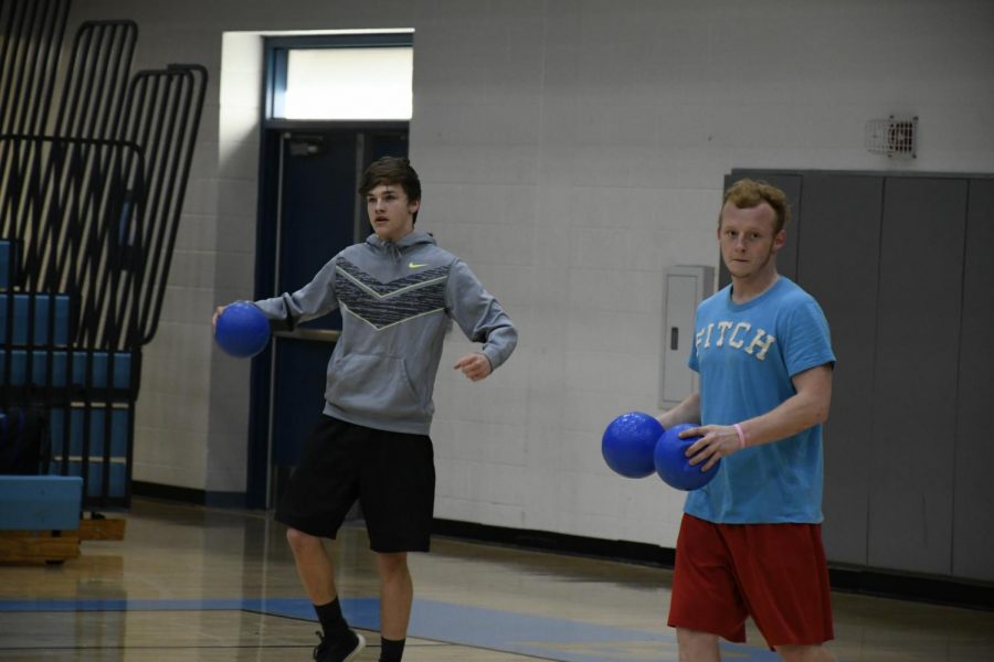 Seniors+Trevor+Miller+%28LEFT%29+and+Hunter+Freeman+compete+in+the+National+Honor+Society%E2%80%99s+annual+dodgeball+tournament+in+the+Boone+gym+on+March+22.+The+event+raised+money+for+the+organization.