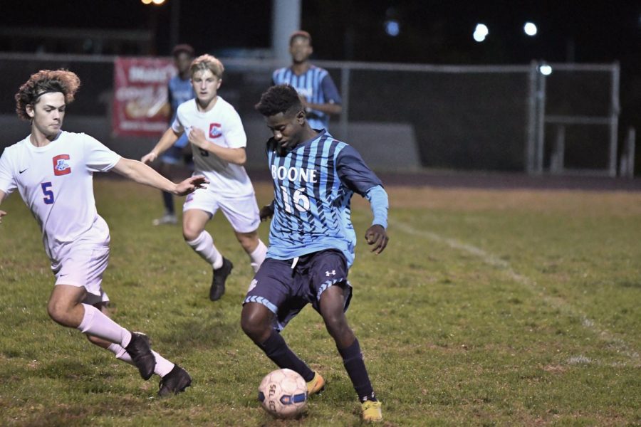 Senior Mardoche Matumueni dribbles the ball during Boones home game vs Conner on Oct. 8.