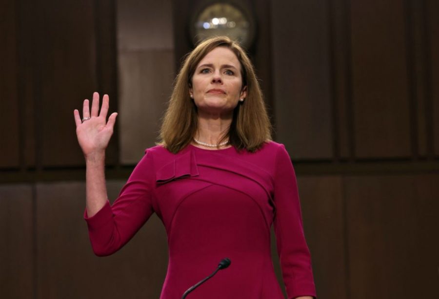 Amy+Coney+Barrett+takes+an+oath+during+a+Senate+hearing+on+Oct.+27.+Barrets+confirmation+to+the+Supreme+Court+makes+her+the+closest+to+be+nominated+and+confirmed+prior+to+an+election.