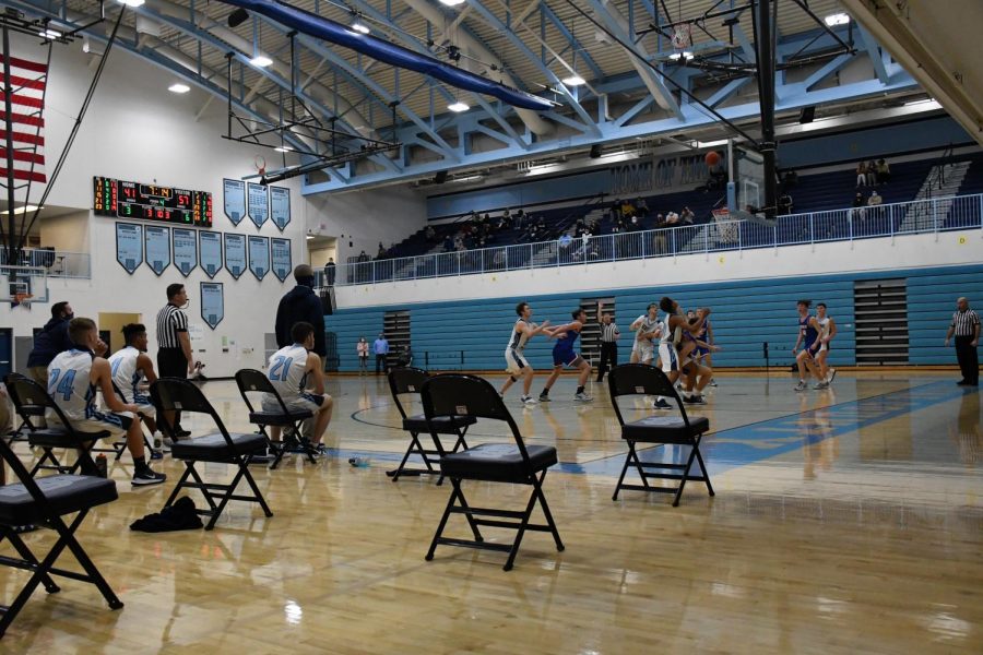 Spaced out player benches, fans restricted to the upper level and no pep band were a few the COVID-related changes that fans noticed during Boone's boys basketball game at home against Conner on Jan. 8.