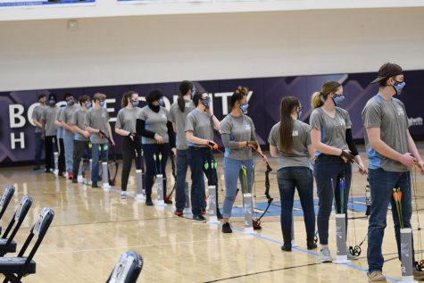 The Rebel Archers line up to shoot from 15 meters at the Boone archery tournament on Feb. 20.