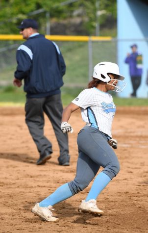 Junior Mia Nixon rounds third base during the fast pitch softball home game against Campbell County on May 10.
