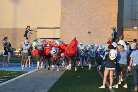 The Rebels make their entrance against Conner High School on Sept. 24.