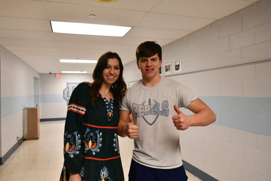 Business+teacher+and+Boone+alumna+Ajla+Ortash+%28LEFT%29+and+junior+Cole+Hardy+pose+in+the+business+hallway.