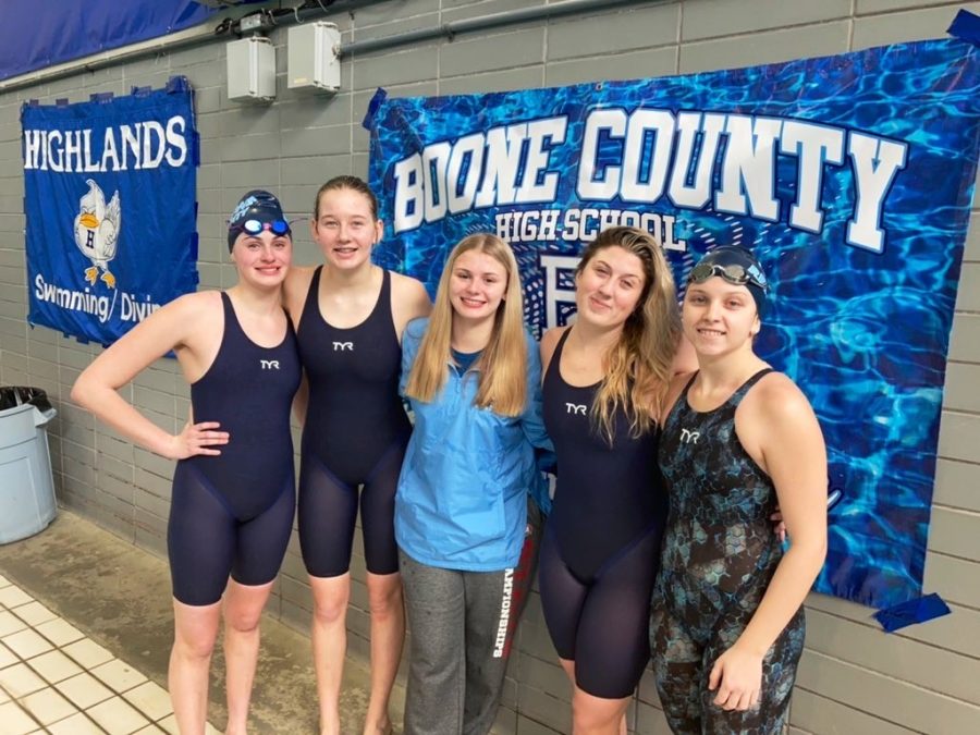 Pictured+from+left+to+right+after+finishing+their+last+race+at+the+KHSAA+state+championship+on+Feb.+19%2C+senior+Bayleah+Vogel%2C+junior+Lexi+Kollar%2C+senior+Sophie+Pile%2C+senior+Naomi+Lively+and+senior+Sydney+Whitford+stand+on+deck+at+Lancaster+Aquatic+Center+in+Lexington.