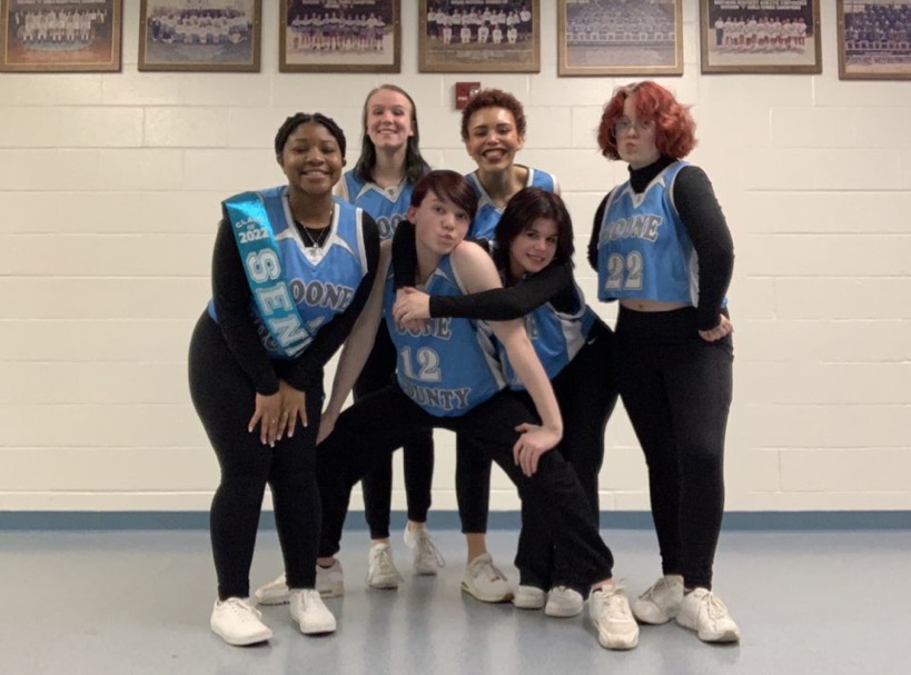 From left to right, senior Trinity Howard, junior Kara Hensley, sophomore Antonio Williams, junior Kira Evans, sophomore Dallas Collins, and sophomore Geode Miller pose together during dance senior night in the gym on Feb. 18.