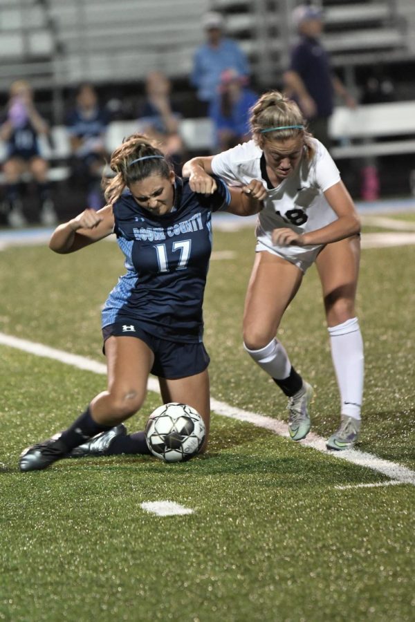 Senior Morgan Lipps battles for the ball against Ryle player during Boone Countys 1-0 win over Ryle on Aug. 31.