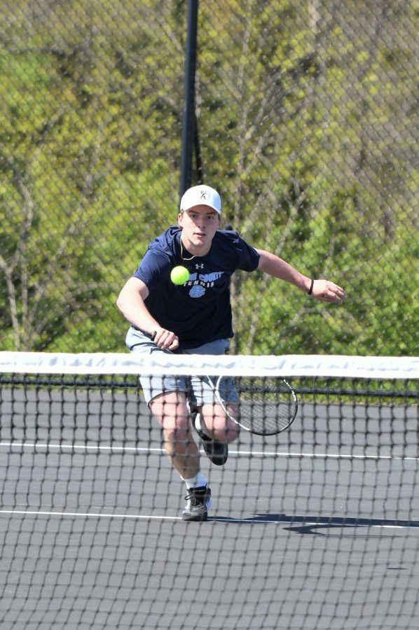 Senior Will Raleigh returns a volley during a tennis match at Scott on April 18. 
