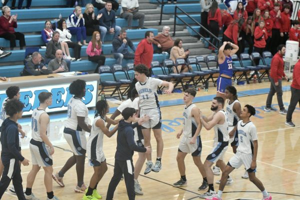 The team celebrates after the close win of 84-82 against Conner on Jan. 12. 