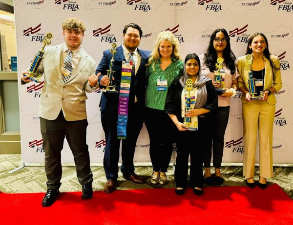 Members of the Future Business Leaders of America pose with their trophies after the state competition at the Galt House in Louisville over spring break. The team also won an award for growth. (Photo Submitted)