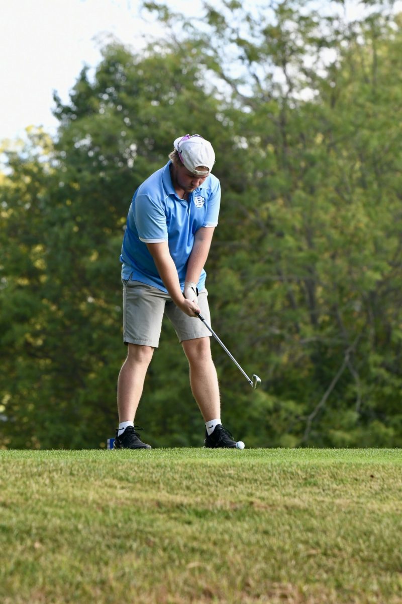 Senior Trenton Wilson prepares to tee off at the Region 7 boys golf championship at Boone Links on Sept. 23.