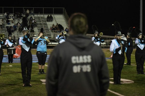 Director Dan Barnhill admires his band as they perform the halftime show on Oct. 18.