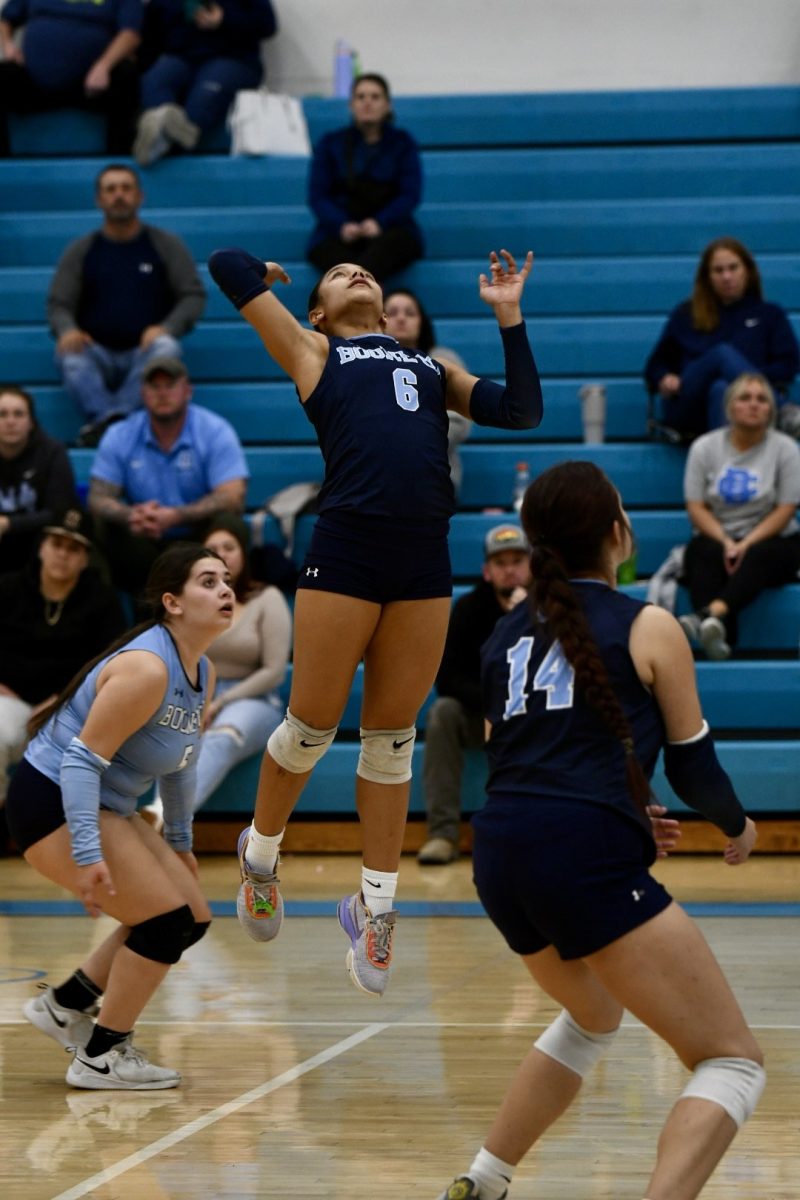 Senior Azaria Sweet leaps into the air to go for a kill during a match against Grant County on Oct. 16. Sweet had 237 kills her senior year, which was nearly double her career total to that point of 134.