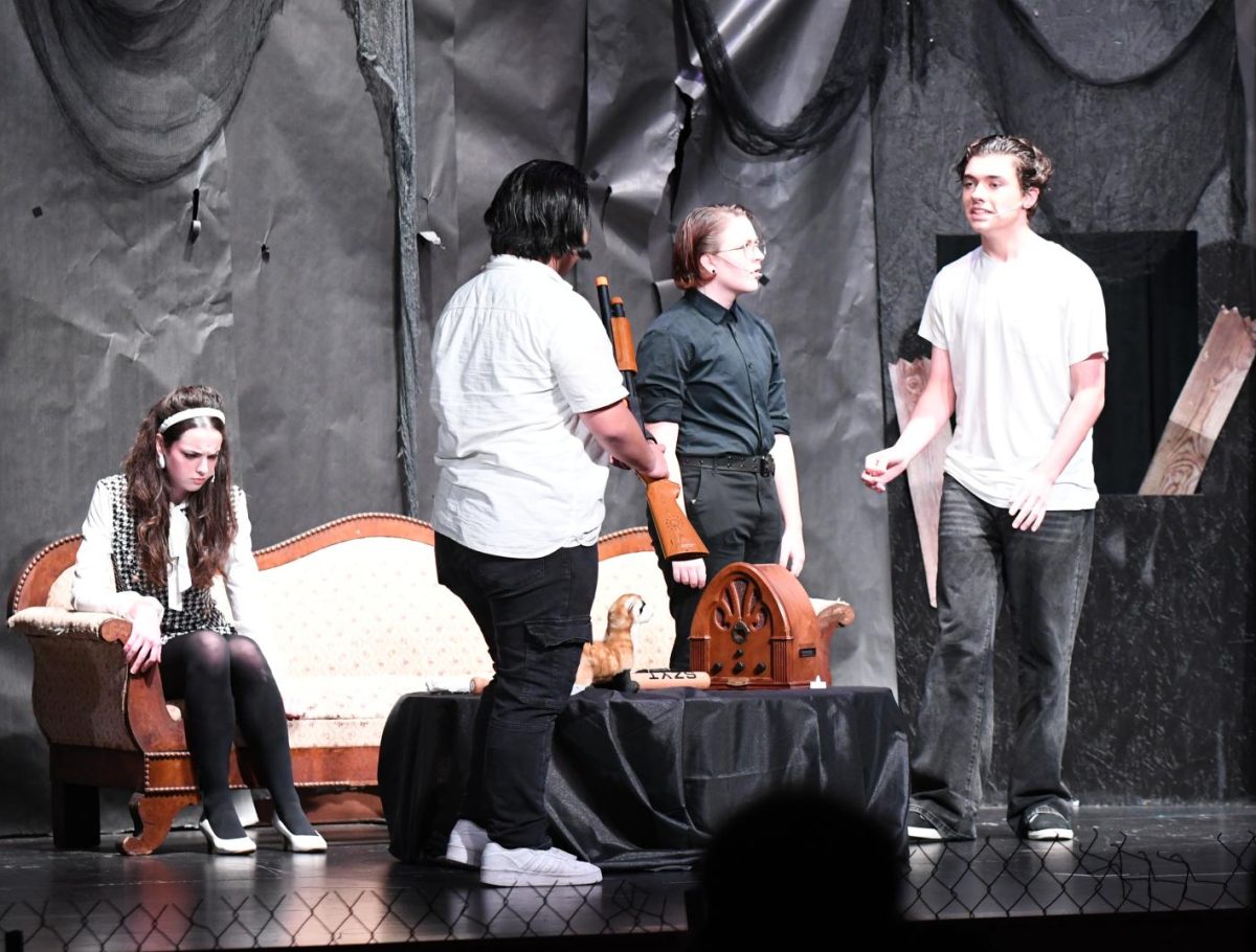 From left to right, senior Saint Manuwere, junior Sunny Miller, and junior Jordan Cox perform in “Night of the Living Dead” on Oct. 25.