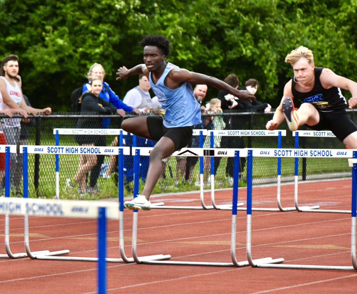 Junior Ibrahim Ngam competes in the 110 meter hurdles at the Region 5 Championship at Scott High School on May 21.