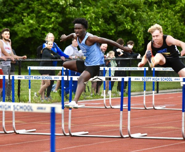 Junior Ibrahim Ngam competes in the 110 meter hurdles at the Region 5 Championship at Scott High School on May 21.
