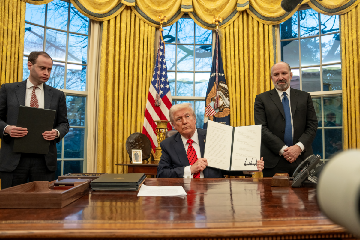 President Trump holds an executive order in the Oval Office on Feb. 10, 2025. Trump has signed 142 executive orders in his first 100 days, which is a record. (Photo from WhiteHouse.gov)