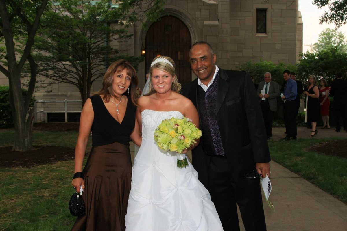 Morvik poses with the Cincinnati Bengals Head Coach Marvin Lewis and his wife Peggy on her wedding day in in 2008. 