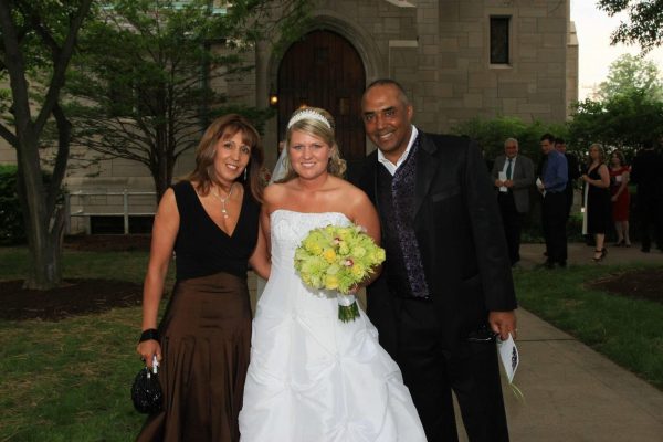 Morvik poses with the Cincinnati Bengals Head Coach Marvin Lewis and his wife Peggy on her wedding day in in 2008. 